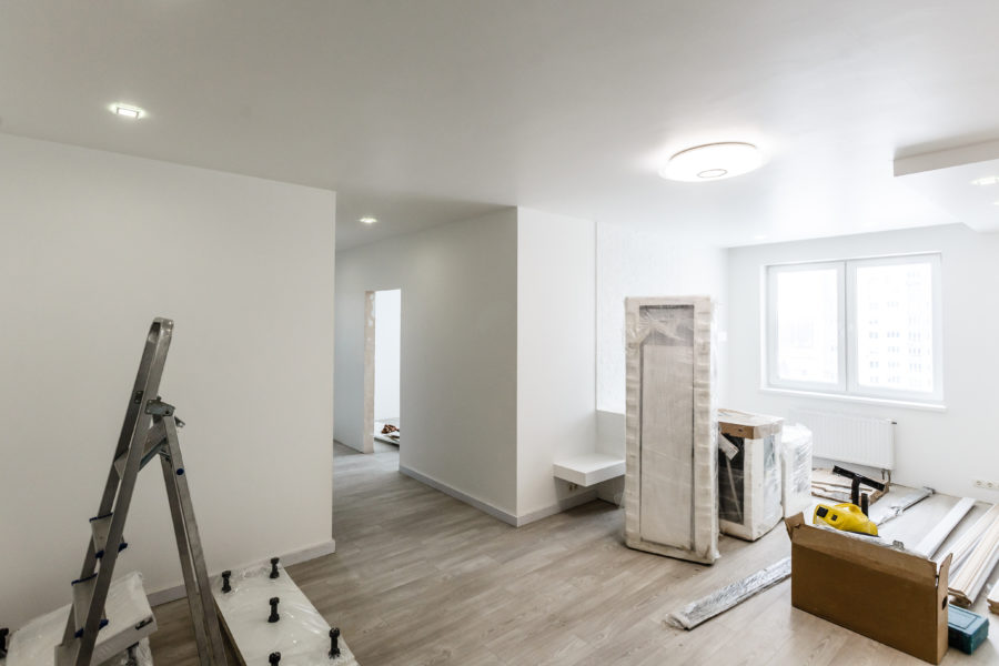 Home renovation in room full of painting tools