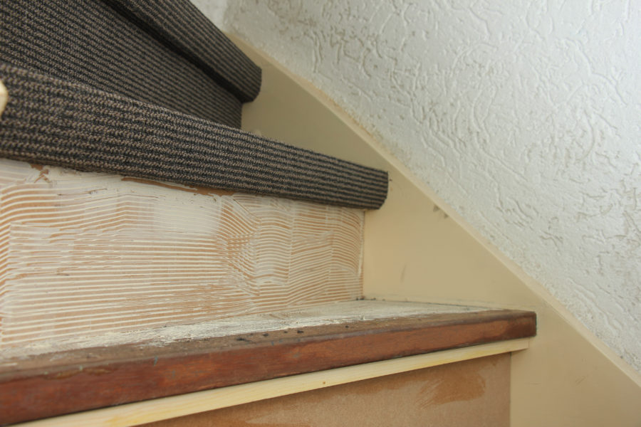 Carpeting a staircase, fresh glue on steps